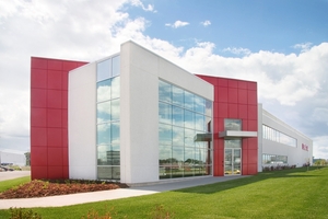 Facade corner with red frame - Structube Warehouse in Saint-Laurent